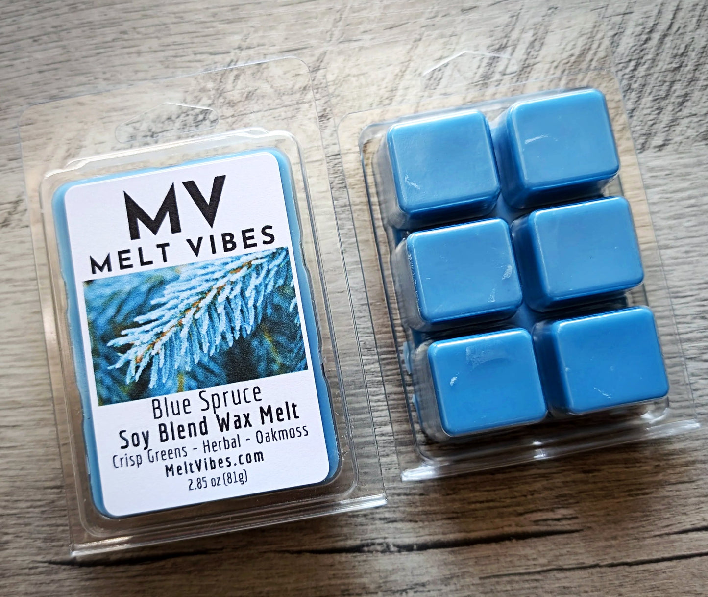 Blue spruce wax melts in a clear packaging on a wooden surface with 'Melt Vibes' branding.