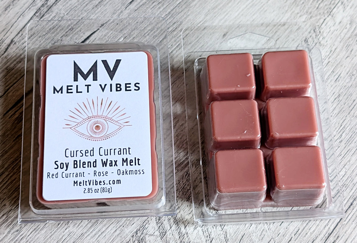 Wax melts in a clear packaging with a label reading 'Melt Vibes' on a wooden surface.