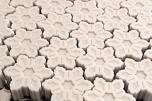 Close-up of white snowflake shaped wax melts