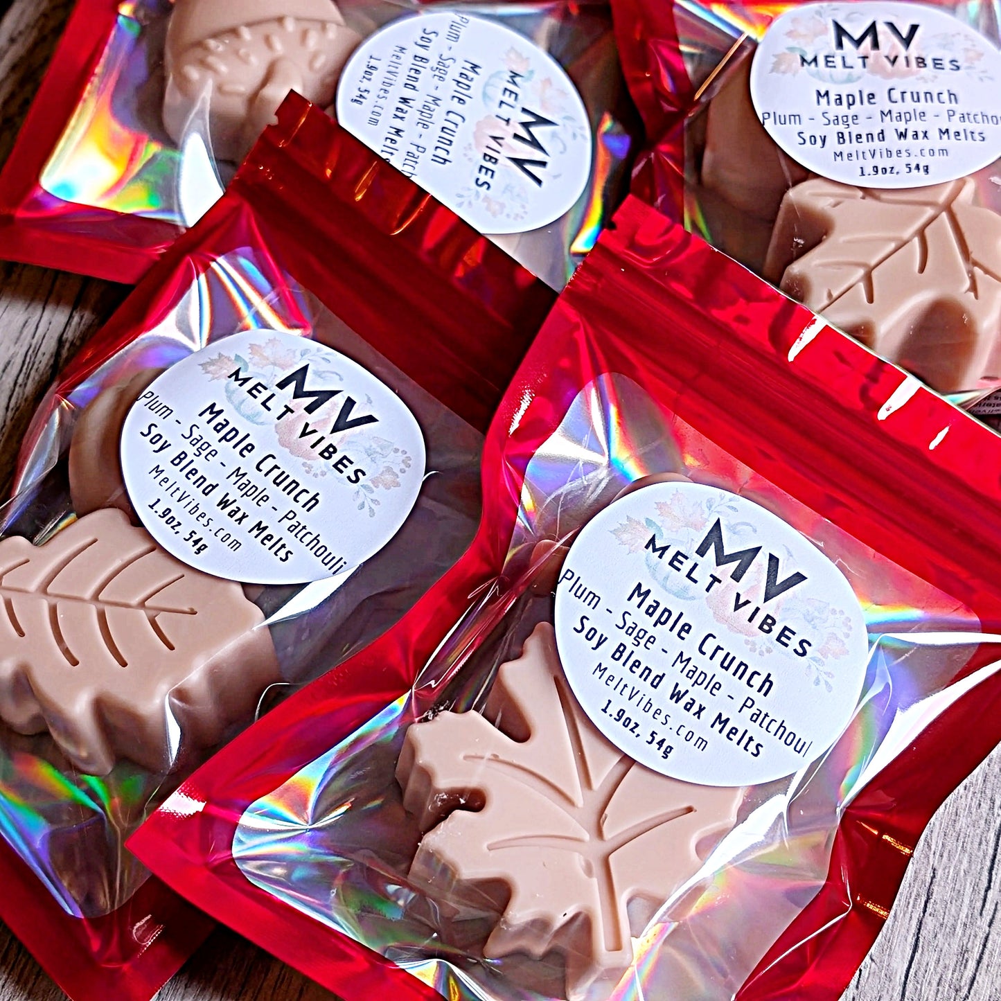 Maple leaf-shaped wax melts in red packaging with 'Melt Vibes' labels