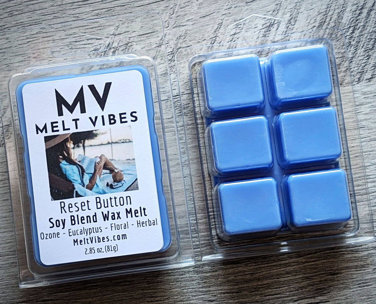 Melt Vibes soy blend wax melts packaging with blue wax cubes on a wooden surface