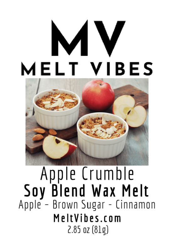 Two ramekins of apple crumble with almonds, sliced apples, and a whole apple on a wooden surface.