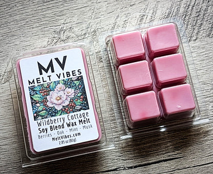 Pink wax melts in a clear container with a 'Melt Vibes' label on a wooden surface.