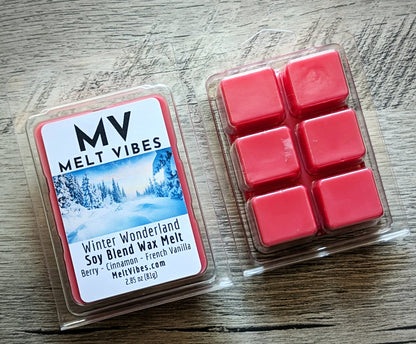 Red wax melts in a clear plastic packaging with 'Melt Vibes' label on a wooden surface