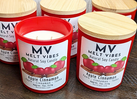 MV Melt Vibes Apple Cinnamon candles with wooden lids on a wooden surface