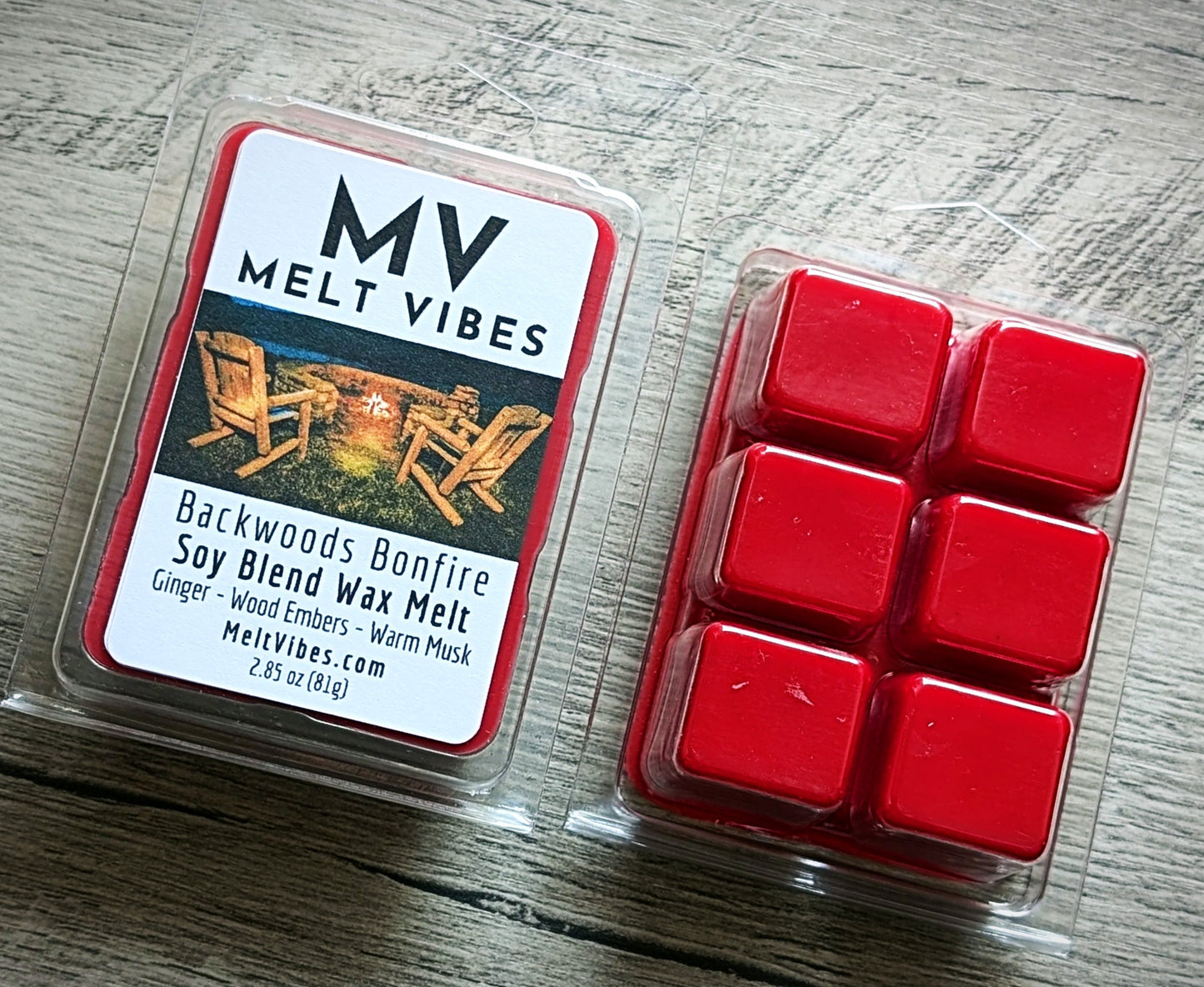 Red wax melts in a clear plastic packaging with 'MV Melt Vibes' label on a wooden surface.