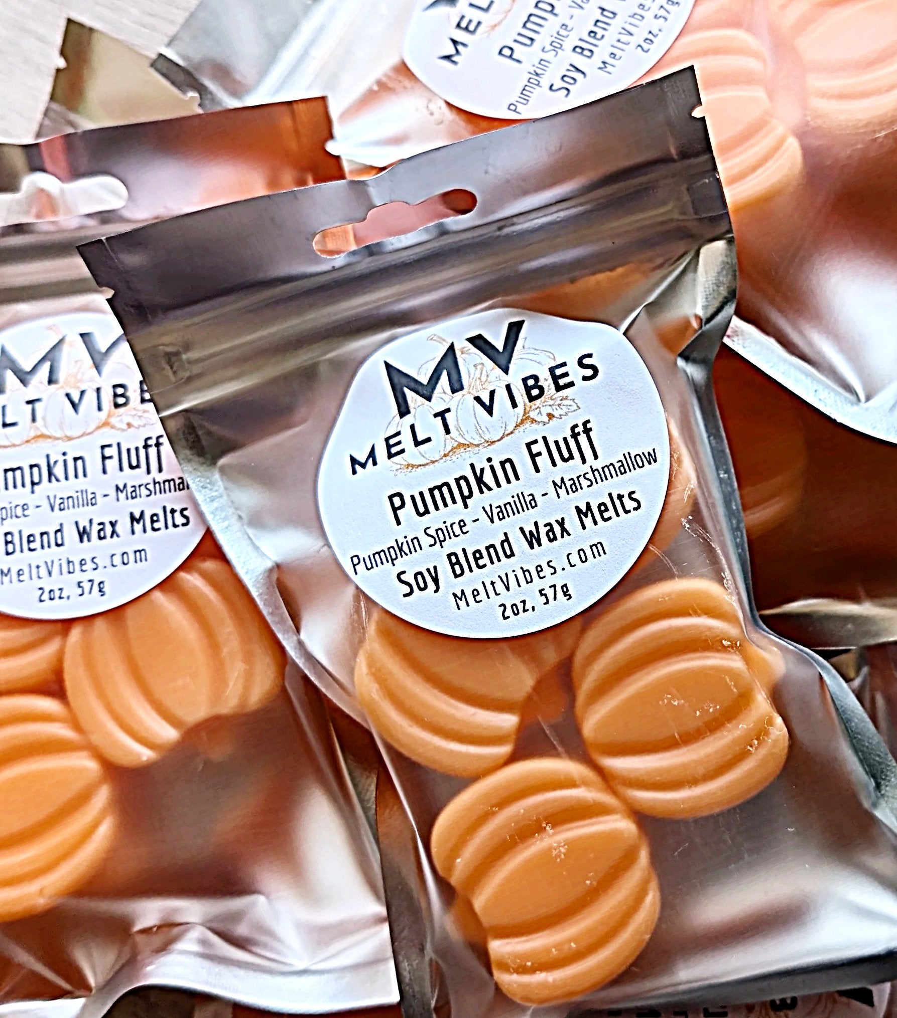 Packaged pumpkin fluff wax melts with 'Melt Vibes' label.