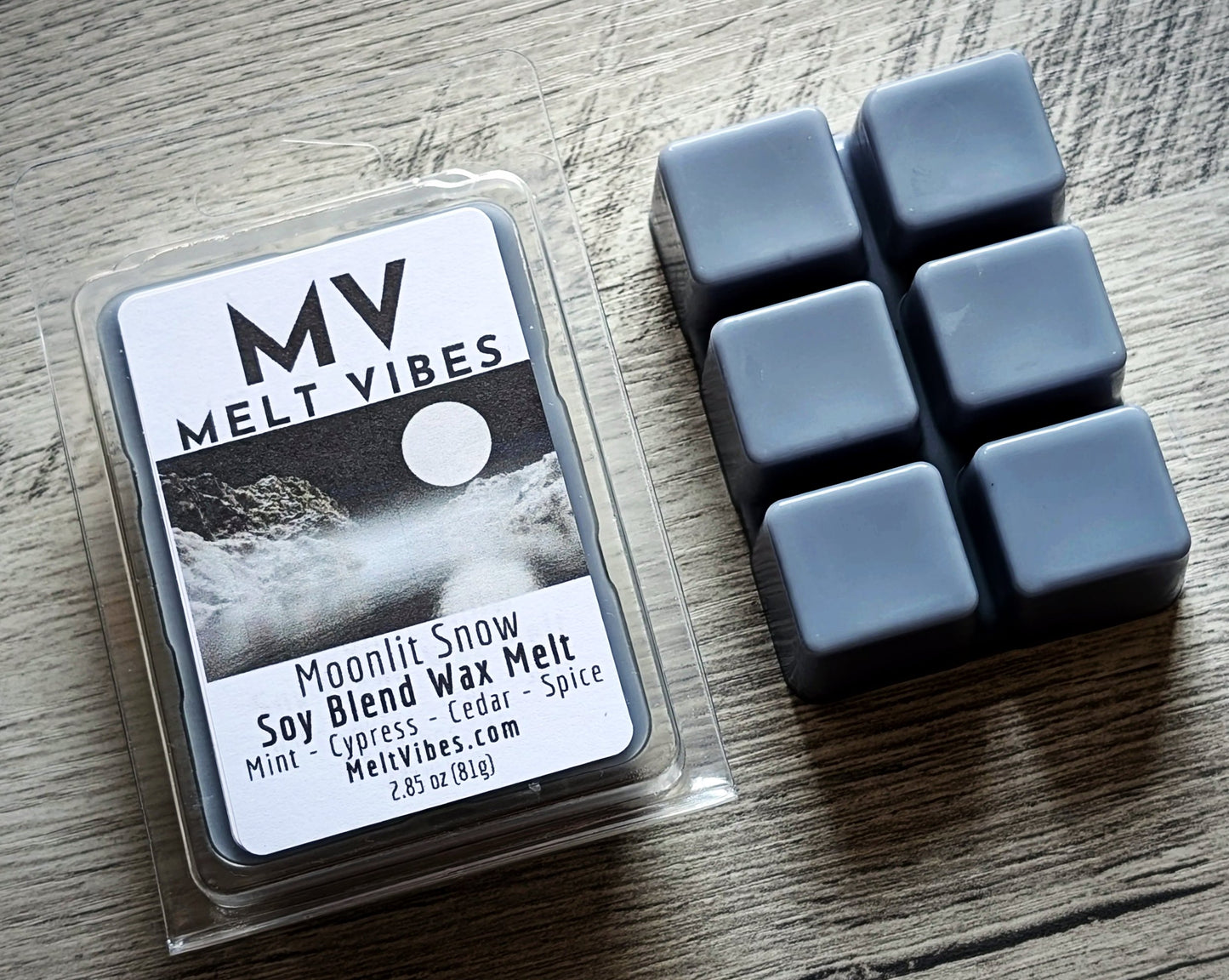 Wax melts in packaging with 'Melt Vibes' branding on a wooden surface