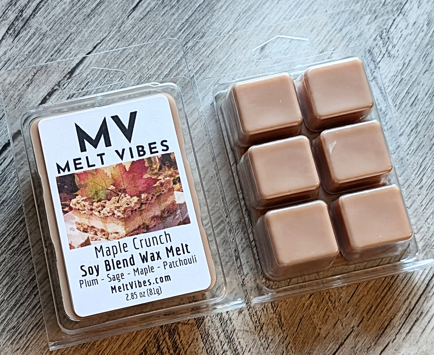 Wax melts in a clear packaging with 'Melt Vibes' label on a wooden surface